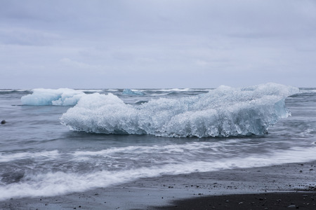 Blue iceberg at the Jokulsarlon glaciar lagoon in Icelandの写真素材