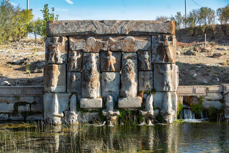 The Hittite spring sanctuary of Eflatun Pinar lies about 100 kilometers west of Konya close to the lake of Beysehir in a hilly, quite arid landscape.の写真素材