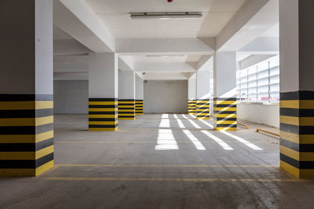 Interior of an empty car parking lot with yellow and black stripesの写真素材
