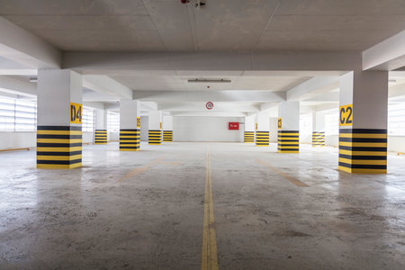 Parking garage interior with yellow and black stripes. Perspective view.の写真素材