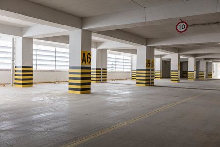 Underground parking garage with yellow and black stripes. Underground parking garageの写真素材