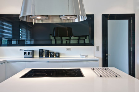 interior of modern kitchen with white built in stove and gas cookerの写真素材