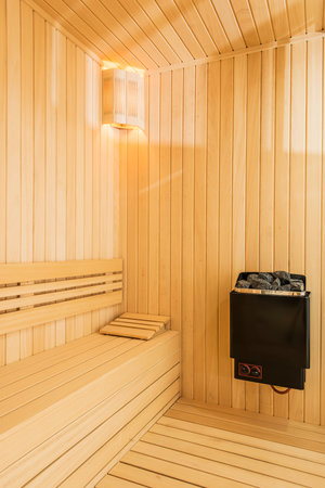 Interior of a sauna room with wooden walls and hot steamの写真素材