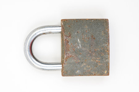 Old rusty padlock isolated on a white background. close upの写真素材