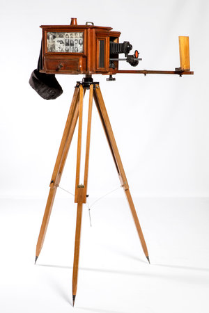 Vintage camera on tripod isolated on white background with clipping path.の写真素材
