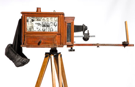 Vintage camera on a tripod, isolated on a white background.の写真素材