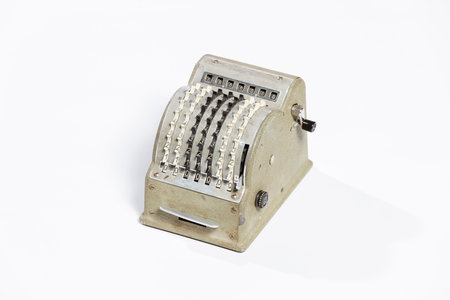 Old cash register isolated on a white background, closeup of photoの写真素材