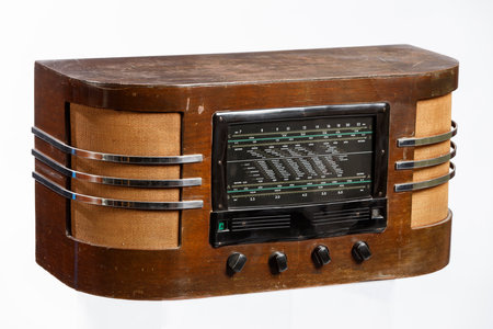 Old wooden radio isolated on a white background, closeup of photoの写真素材