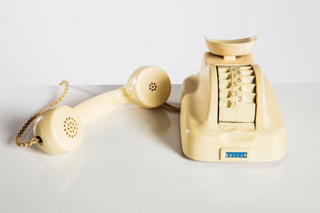 Old telephone on a white background. Vintage telephone on a white background.の写真素材