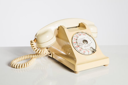 Old vintage telephone on white background with clipping path and copy space.の写真素材