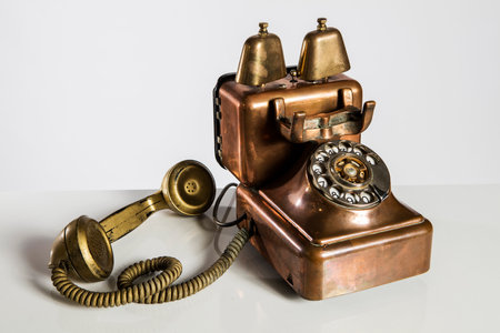 Vintage telephone on white background with copy space for your text.の写真素材