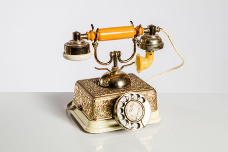 Vintage telephone isolated on a white background with clipping path and copy spaceの写真素材