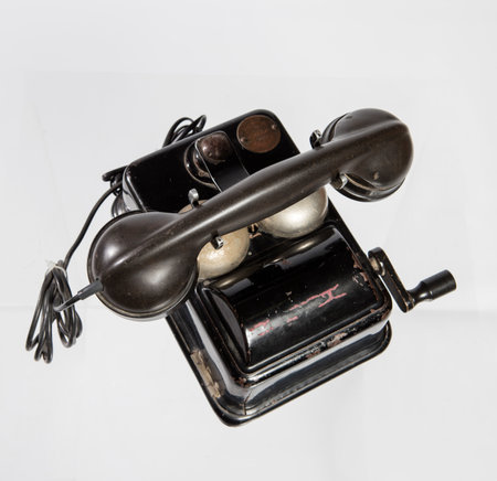 Old telephone on a white background, close-up, isolated.の写真素材