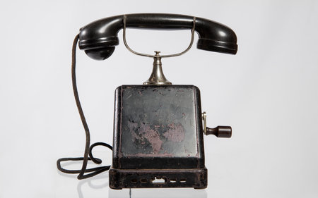 Old telephone on a white background, close-up, isolate.の写真素材