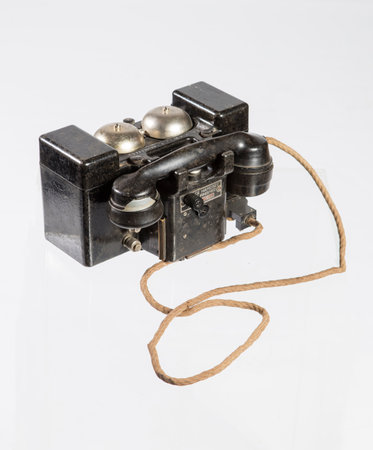 Vintage telephone isolated on a white background, closeup of photoの写真素材