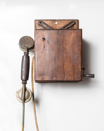 Old telephone on white background with copy space for text or image.の写真素材