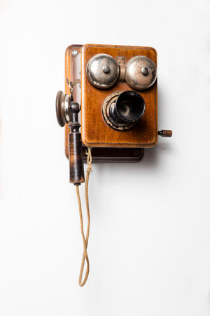 Vintage telephone on a white background. Photo in old color image style.の写真素材