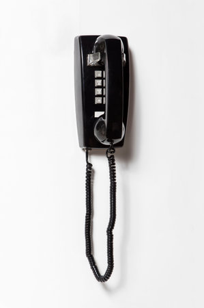 Black telephone isolated on white background with clipping path. top view
