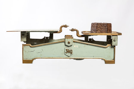 Vintage scale on a white background, close-up of photoの写真素材