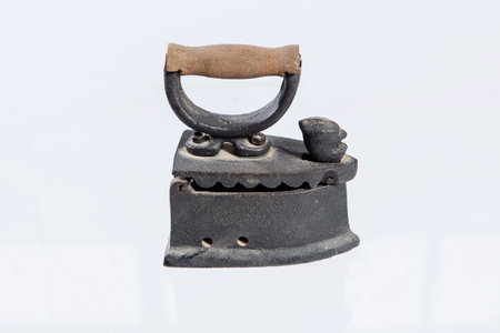 Old iron on a white background, close-up, isolate.の写真素材