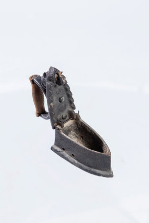 Old iron on a white background. Close-up. isolatedの写真素材