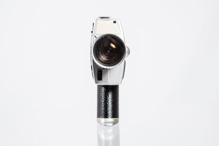 Old camera isolated on a white background with reflection and copy space.の写真素材
