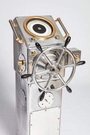 Steering wheel of a sailing boat on a white background, close-upの写真素材