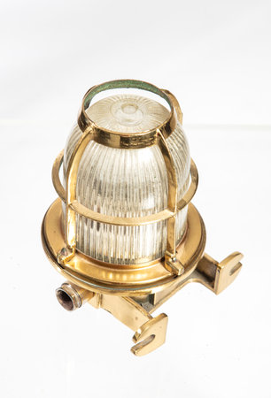 Old rusty red kerosene lamp isolated on a white background.の写真素材