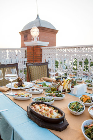 Table set for dinner on the terrace of a luxury hotel.