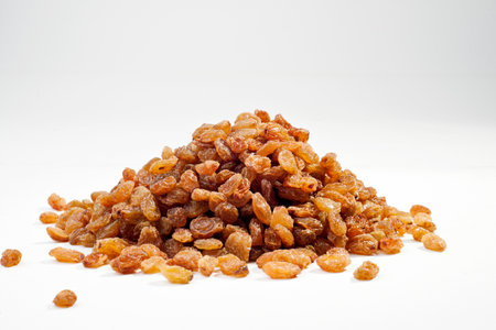 Pile of raisins isolated on white background with copy spaceの写真素材