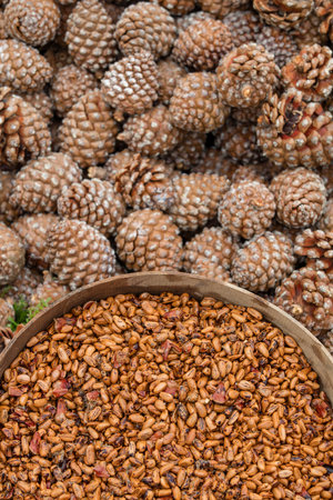Pine cones and pine nuts for sale in a market, closeupの写真素材