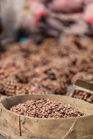 Coffee beans in a basket on a market in India.の写真素材