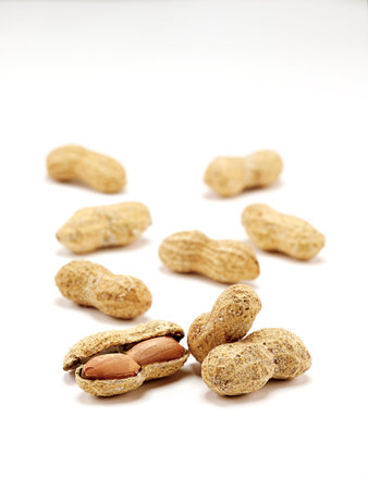 peanuts isolated on white background. close-up studio shotの写真素材