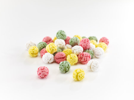Colorful rice balls on white background. Selective focus with shallow depth of field.の写真素材