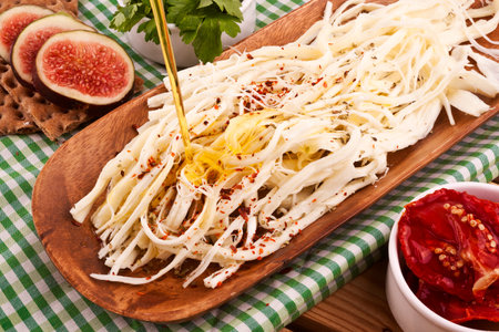 Noodles with cheese and fresh figs on wooden background.の写真素材