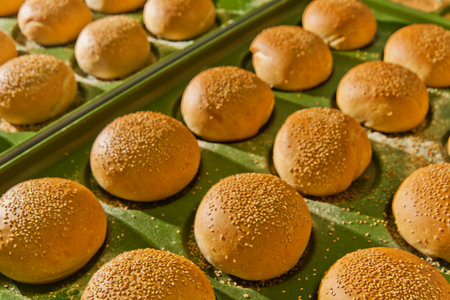 Bread buns with sesame seeds on green banana leaf.の写真素材