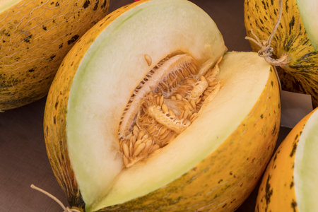 Close up of cantaloupe melon on wooden table.の写真素材