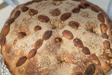 Bread with almonds and sesame seeds. Close-up.