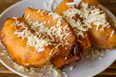 Fried pears with cheese on a wooden background. Selective focus.の写真素材