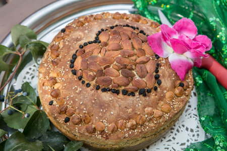 Easter cake with nuts and raisins on a festive table