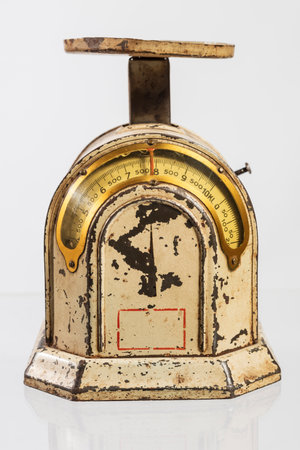 Old vintage kitchen scale isolated on a white background. Shallow depth of field.の写真素材