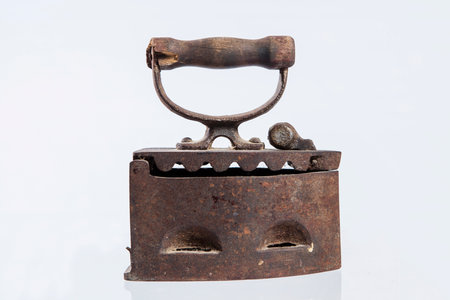 Old iron on a white background, close-up of photo.の写真素材