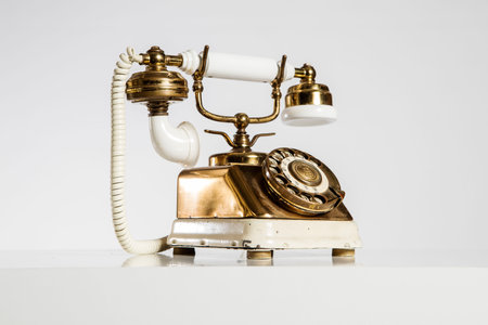Old telephone on a white background. Retro telephone. Vintage telephone.の写真素材