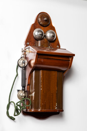 Old telephone isolated on a white background. Close-up image.の写真素材