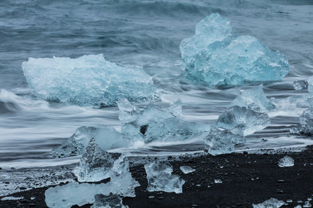 Big pieces of ice (floe) from glacier in the lake, ice islands, glacier and mountains,...