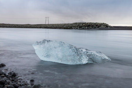 Big pieces of ice (floe) from glacier in the lake, ice islands, glacier and mountains, JÃ¶kulsÃ¡rlÃ³n - Glacier Lagoonの写真素材