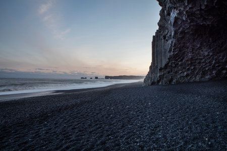 Basalt rock formations Troll toes on black beach. Reynisdrangar, Vik, Iceland