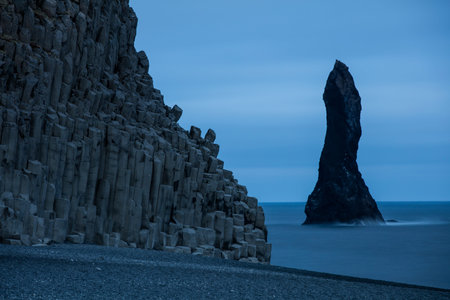 Basalt rock formations Troll toes on black beach. Reynisdrangar, Vik, Iceland