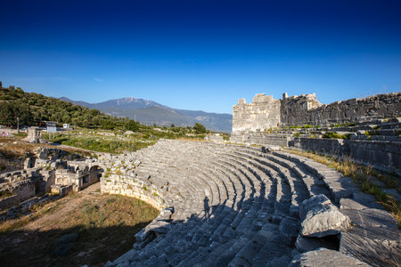 Xanthos Ancient City. Grave monument and the ruins of ancient city of Xanthos - Letoon in Kas, Antalya, Turkey at sunset. Capital of Lycia.の写真素材