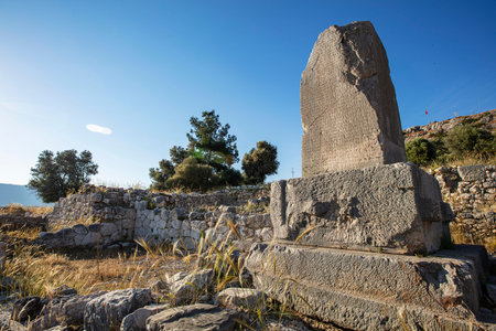 Xanthos Ancient City. Grave monument and the ruins of ancient city of Xanthos - Letoon in Kas, Antalya, Turkey at sunset. Capital of Lycia.の写真素材
